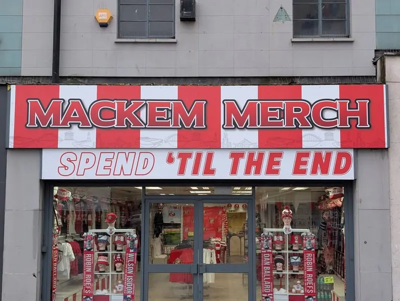 Red and white ACM fascia sign for Mackem Merch in Sunderland