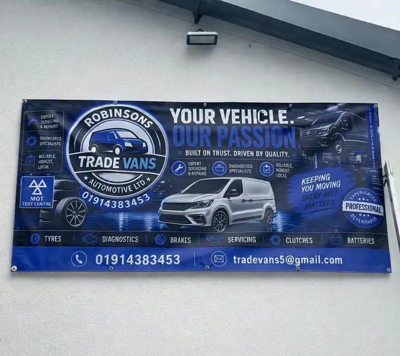 Full-colour PVC banner for Robinsons Trade Vans on an outside wall